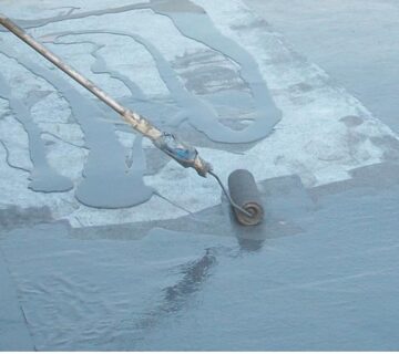 Applying Impermax Cold Polyurea with a roller.